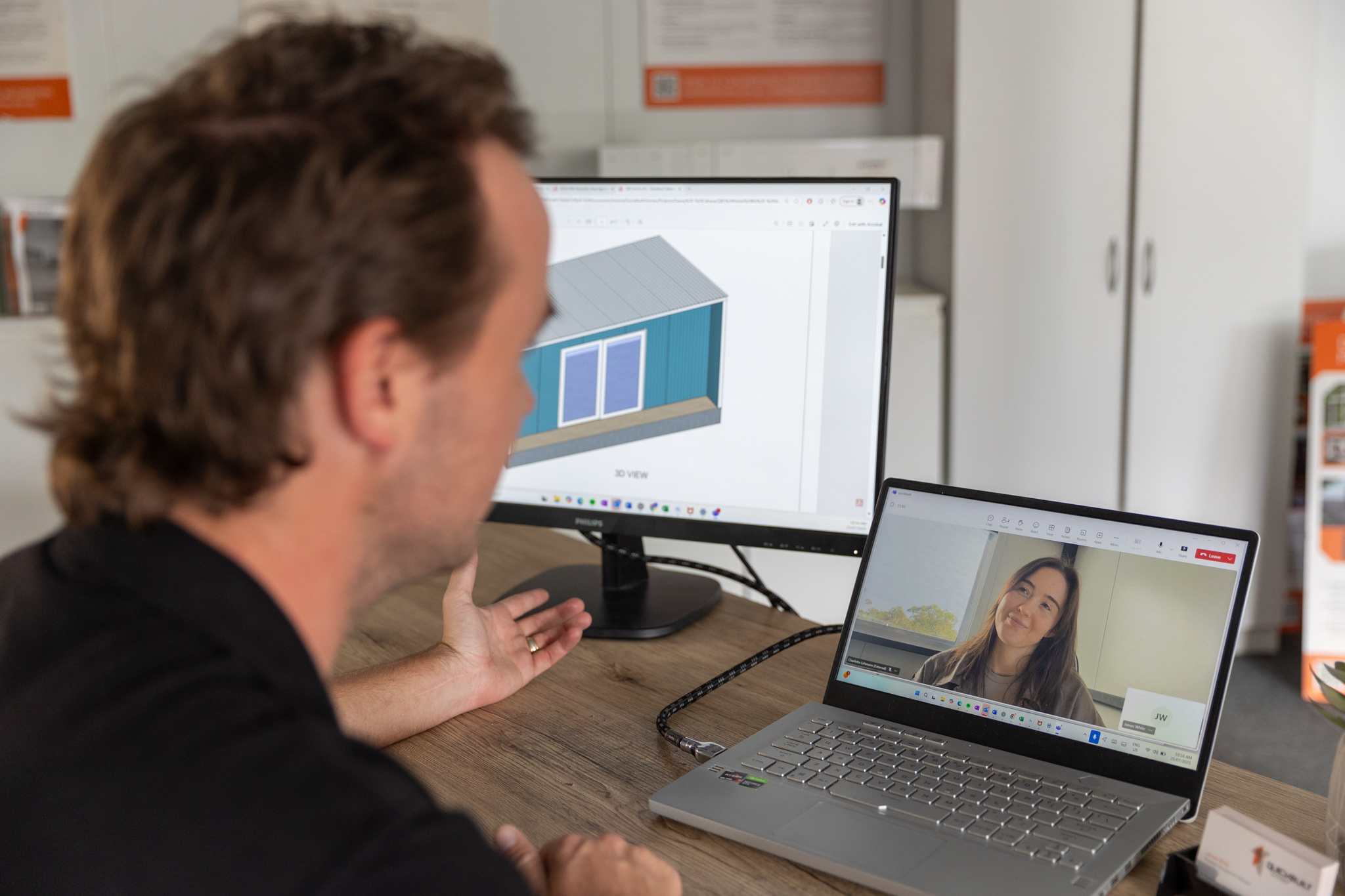A Quick Built designer walking a customer through their layout